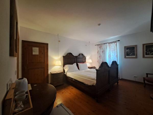 La Vineria di San Mattia : photo 1 de la chambre chambre double ou lits jumeaux standard - vue sur jardin