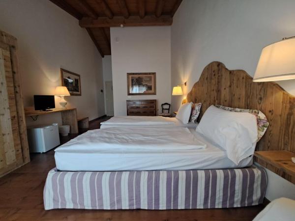 La Vineria di San Mattia : photo 3 de la chambre chambre double ou lits jumeaux deluxe – vue sur jardin