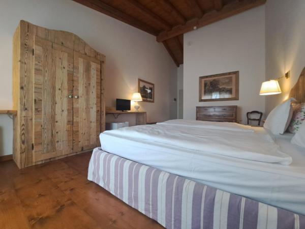 La Vineria di San Mattia : photo 6 de la chambre chambre double ou lits jumeaux deluxe – vue sur jardin