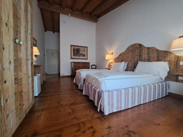 La Vineria di San Mattia : photo 4 de la chambre chambre double ou lits jumeaux deluxe – vue sur jardin