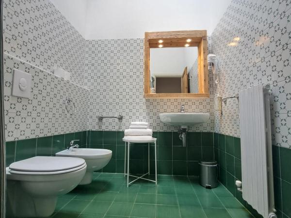 La Vineria di San Mattia : photo 7 de la chambre chambre double ou lits jumeaux deluxe – vue sur jardin