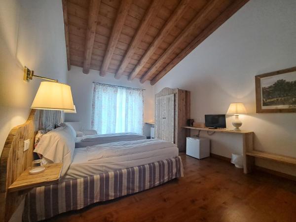 La Vineria di San Mattia : photo 8 de la chambre chambre double ou lits jumeaux deluxe – vue sur jardin