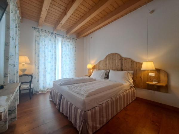 La Vineria di San Mattia : photo 1 de la chambre chambre double ou lits jumeaux supérieure - vue sur jardin