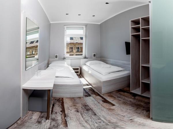 Do Step Inn Meidling - Self-Service-Hotel : photo 2 de la chambre chambre d'hôtel lits jumeaux