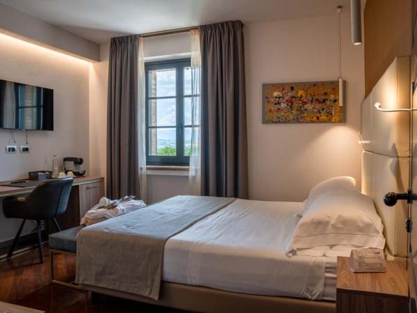 Le Cappuccinelle Suites&SPA : photo 3 de la chambre chambre lit king-size deluxe