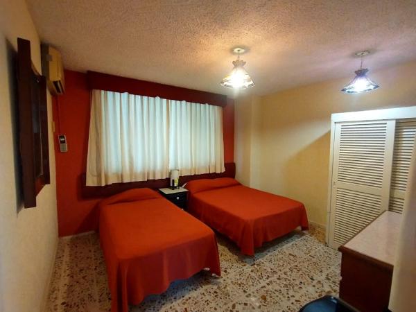 Suites Angelopolis : photo 3 de la chambre chambre familiale supérieure