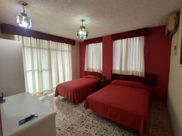 Suites Angelopolis : photo 1 de la chambre chambre familiale supérieure