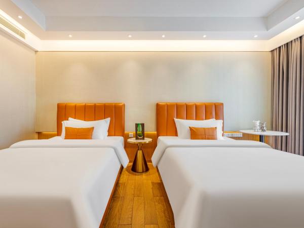 Raffles Executive Apartment - Guangzhou Huijin International Finance Center, Keyun Road Metro Station Branch-Canton Fair Free Shuttle : photo 1 de la chambre chambre lits jumeaux deluxe