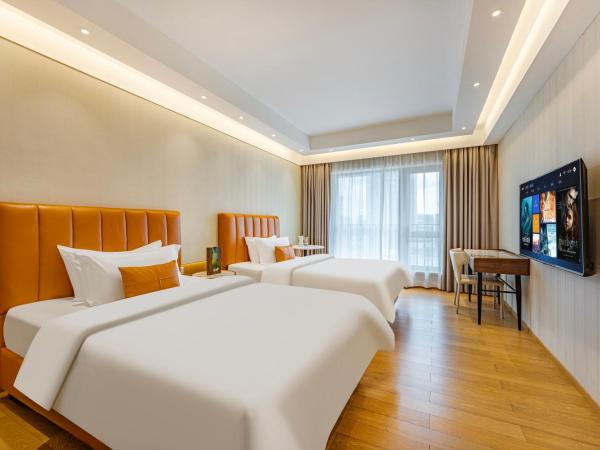 Raffles Executive Apartment - Guangzhou Huijin International Finance Center, Keyun Road Metro Station Branch-Canton Fair Free Shuttle : photo 2 de la chambre chambre lits jumeaux deluxe