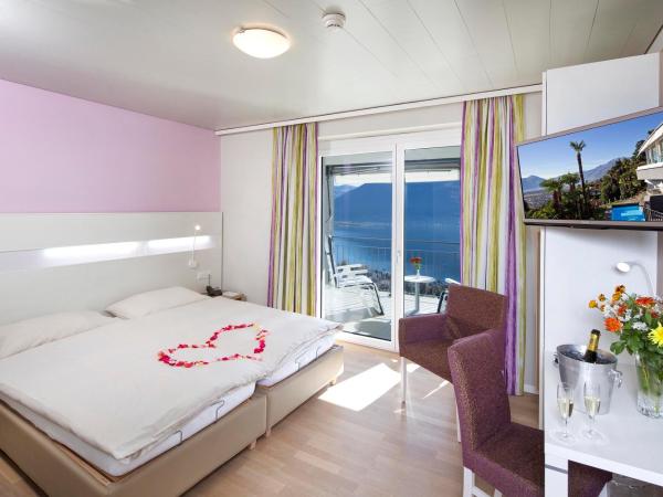 Hotel Stella SA : photo 1 de la chambre  chambre double ou lits jumeaux lifestyle - vue sur lac