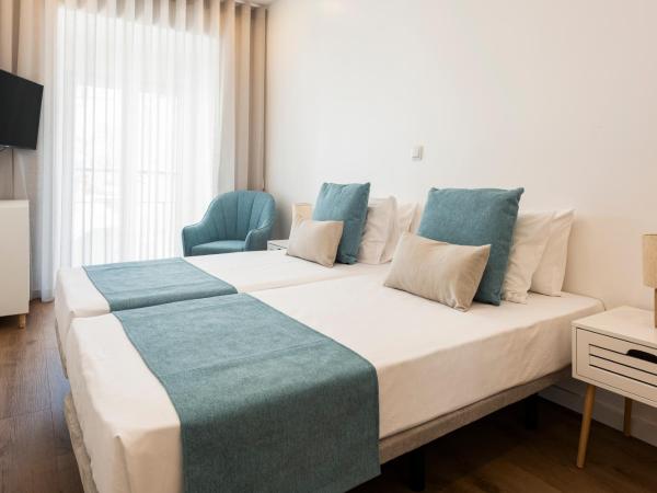 Madalena Hostel e Suites : photo 4 de la chambre chambre double avec salle de bains privative