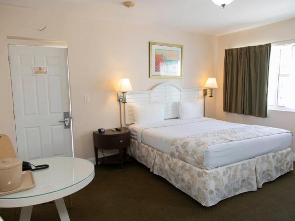 Beach Place Hotel : photo 9 de la chambre hébergement lit king-size supérieur avec kitchenette - parking gratuit