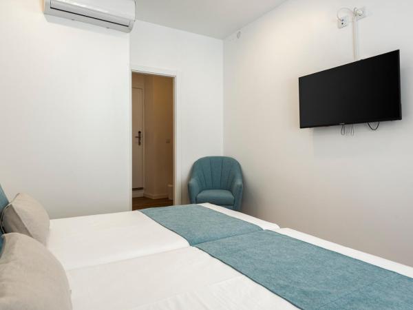 Madalena Hostel e Suites : photo 1 de la chambre chambre double avec salle de bains privative