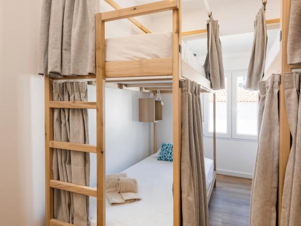 Madalena Hostel e Suites : photo 2 de la chambre lit dans dortoir pour femmes de 4 lits