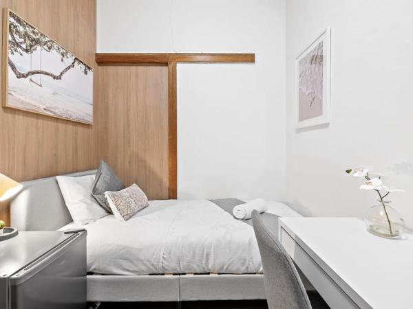 Cozy Single Room - Next to Eateries & Shops - Shared Bathroom : photo 1 de la chambre chambre simple avec salle de bains commune