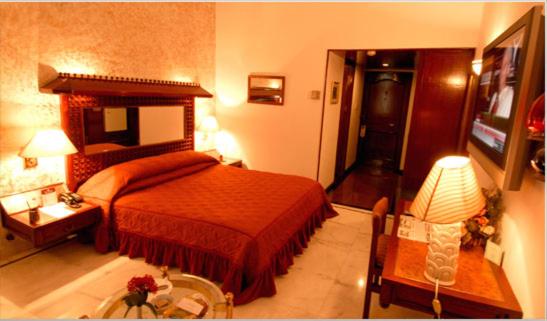 Ashok Country Resort : photo 5 de la chambre chambre double deluxe (2 adultes + 1 enfant)