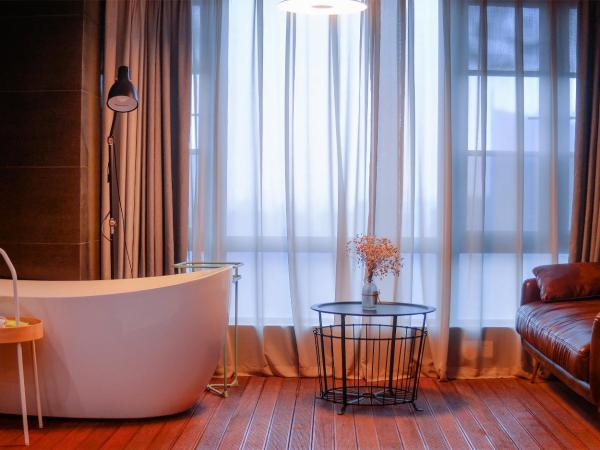 笑脸里青年旅舍天府店 : photo 2 de la chambre chambre lit queen-size deluxe