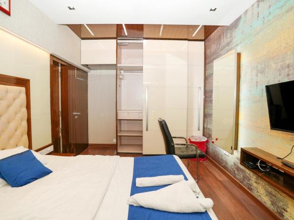 Zenith Homes - Powai Suites : photo 4 de la chambre chambre double avec salle de bains privative