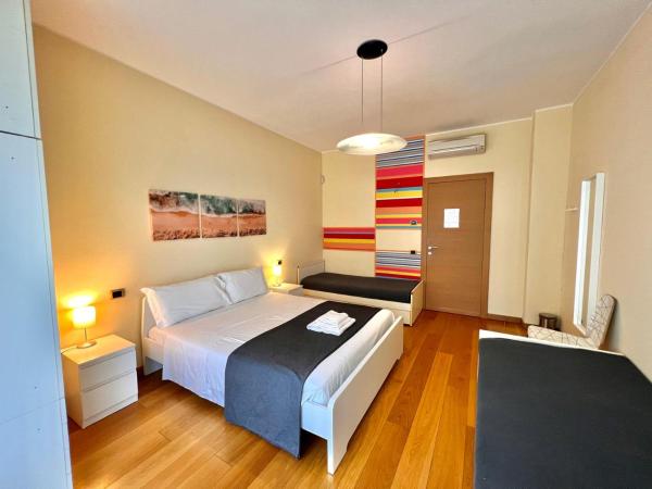 Bergamoinhouse : photo 2 de la chambre chambre quadruple avec salle de bains privative séparée