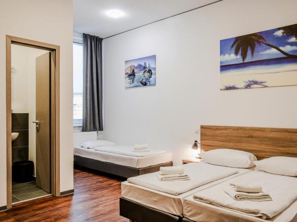 Queens Residenz : photo 1 de la chambre chambre triple