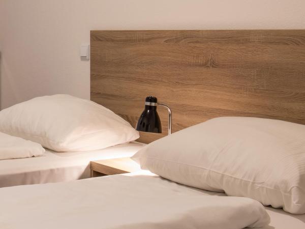 Queens Residenz : photo 1 de la chambre chambre lits jumeaux