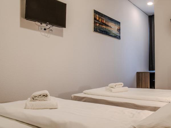 Queens Residenz : photo 3 de la chambre chambre lits jumeaux