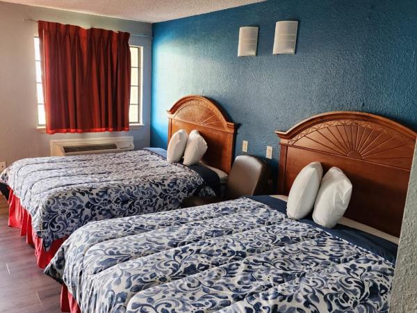 Regency Inn - Fort Sam Houston : photo 1 de la chambre chambre lit queen-size 