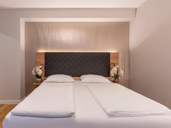 PLAZA INN Rieker Stuttgart Hauptbahnhof : photo 6 de la chambre chambre triple confort