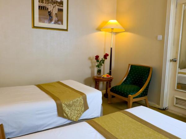 Merdeka Palace Hotel & Suites : photo 2 de la chambre chambre lits jumeaux standard