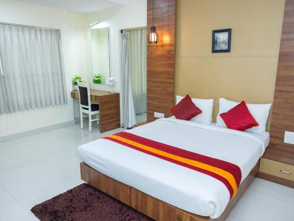 Ishwerya Suites : photo 5 de la chambre chambre lit king-size deluxe