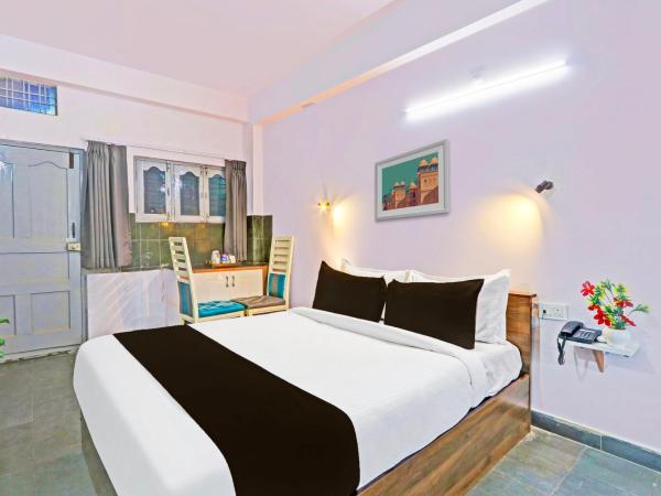 Collection O De Alphabet Hotel UMCC : photo 3 de la chambre chambre triple classique