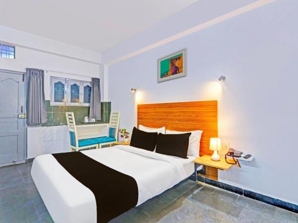 Collection O De Alphabet Hotel UMCC : photo 5 de la chambre chambre triple classique