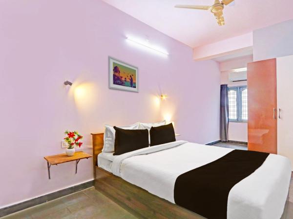 Collection O De Alphabet Hotel UMCC : photo 2 de la chambre chambre triple classique