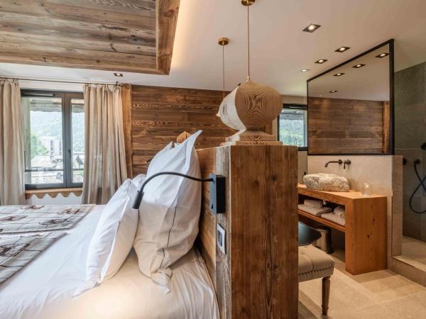 Chalet-Hôtel Hermitage : photo 9 de la chambre suite confortable avec accès au spa