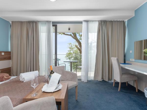 Boutique Hotel Mali Raj : photo 2 de la chambre chambre double ou lits jumeaux deluxe - vue sur mer