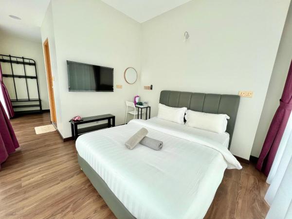 New Margo Hotel KK : photo 1 de la chambre chambre lit queen-size