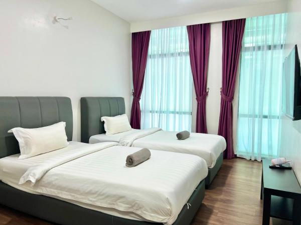 New Margo Hotel KK : photo 5 de la chambre chambre familiale