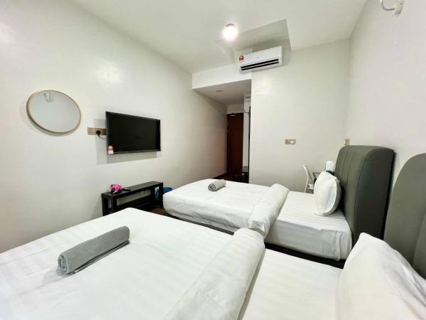 New Margo Hotel KK : photo 4 de la chambre chambre lits jumeaux