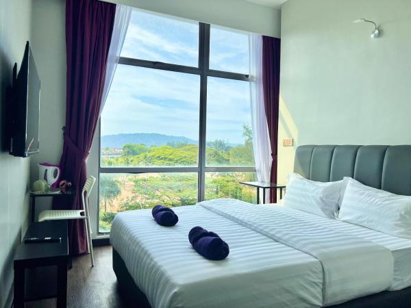 New Margo Hotel KK : photo 7 de la chambre chambre lit queen-size - vue sur jardin