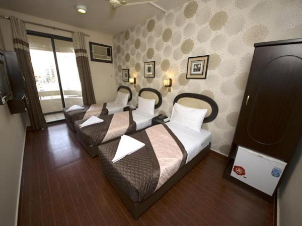 Grand Sina Hotel : photo 1 de la chambre chambre triple