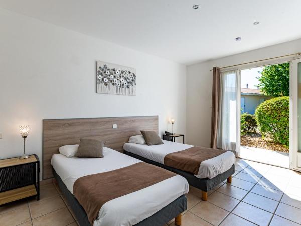 Logis Hôtel L'Oliveraie : photo 2 de la chambre chambre lits jumeaux