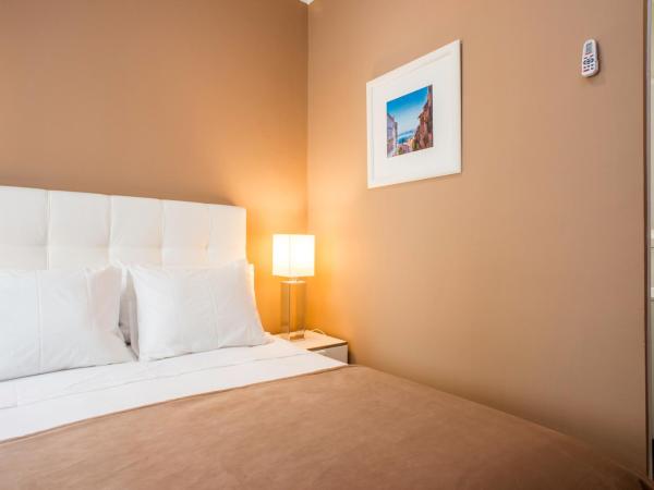 PH Downtown Suites : photo 5 de la chambre petite chambre double