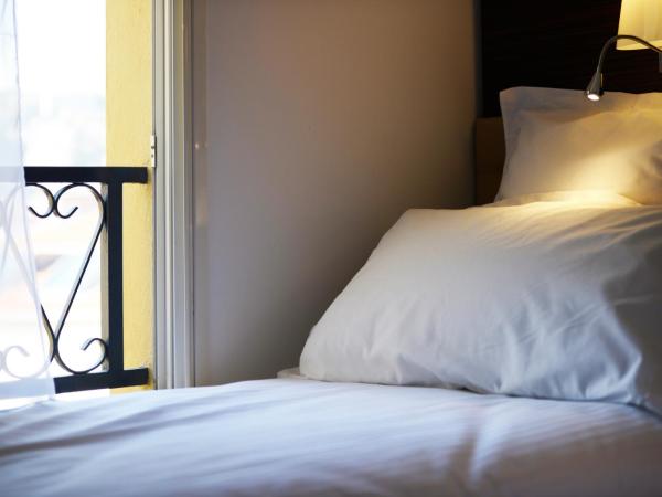 Hôtel & Appartements Monsigny : photo 1 de la chambre petite chambre simple (1 adulte)