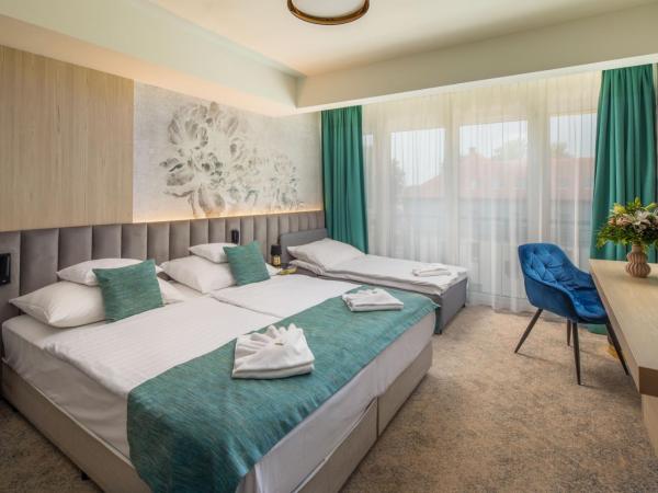 Sungarden Wellness Hotel Siófok : photo 2 de la chambre chambre double ou lits jumeaux avec lit d'appoint