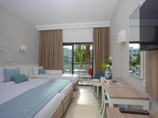 Nozha Beach Resort & Spa : photo 1 de la chambre chambre triple standard