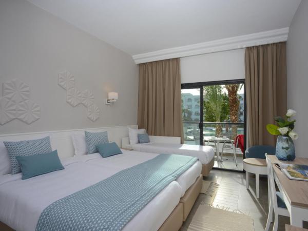 Nozha Beach Resort & Spa : photo 1 de la chambre chambre triple - vue sur mer