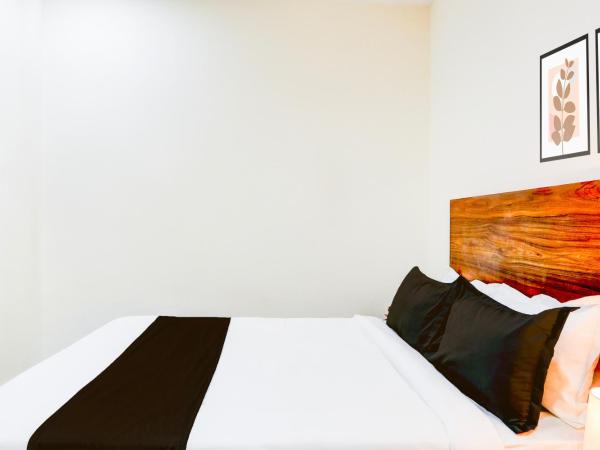 Super Collection O HOTEL SS BLUE INN : photo 7 de la chambre chambre triple classique