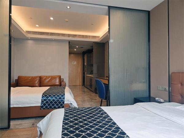 NOMO Beijing Rd A Jiedeng Mix International Apartment : photo 1 de la chambre chambre affaires lits jumeaux