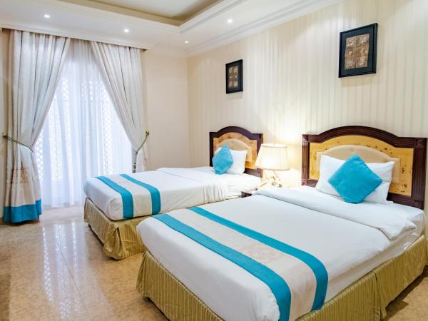 Garden Hotel Muscat By Royal Titan Group : photo 4 de la chambre chambre lits jumeaux