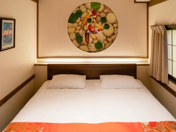 都電屋 TodenHotel : photo 2 de la chambre chambre lits jumeaux avec lit d’appoint - 301